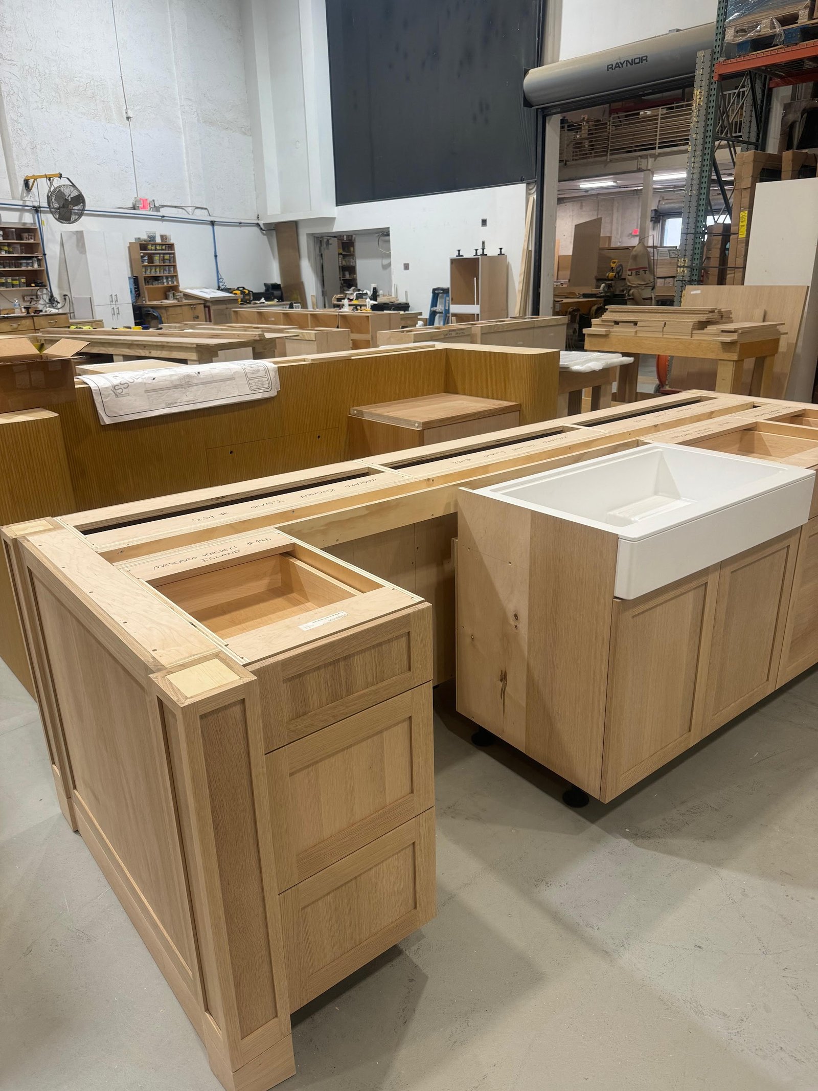 Custom kitchen island pre-assembled and checked in the M11 Design Group shop before installation