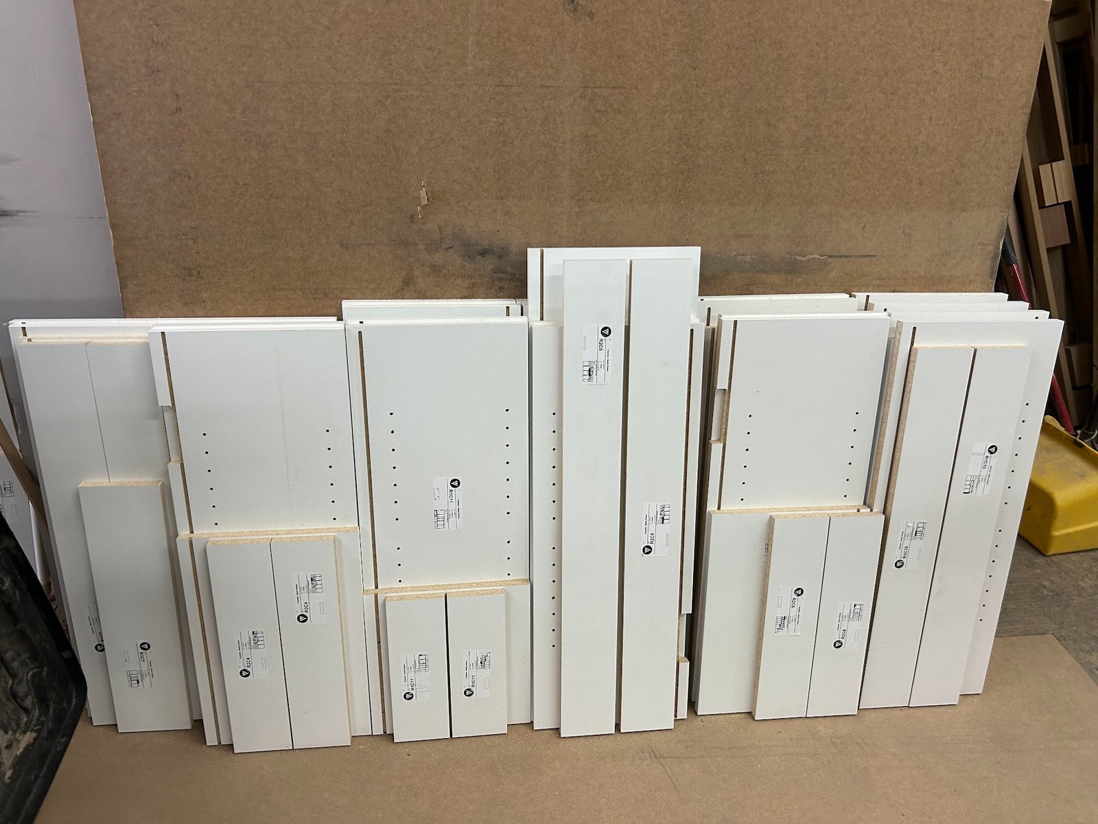 Production cutlists and labeled flat-pack components prepared from M11 Design Group files