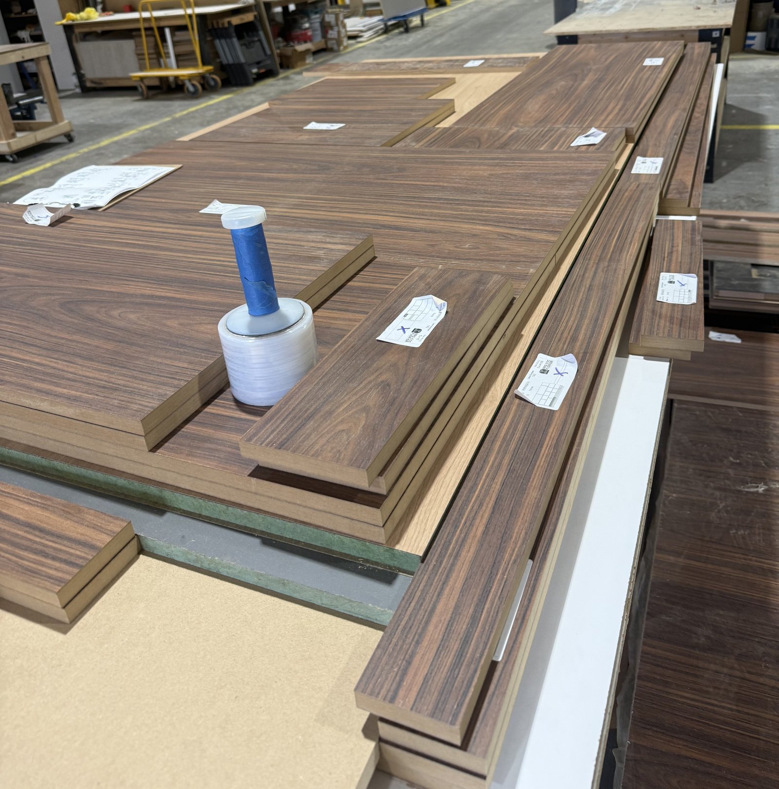Cabinetry components edged and labeled by room in the M11 Design Group shop